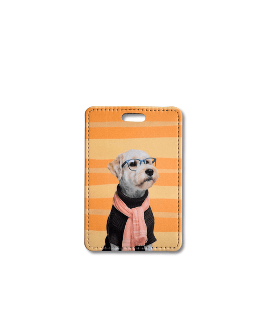 funny wheaten terrier bag tag; soft-coated wheaten terrier wearing blue glasses, black sweater, and apricot scarf on an orange striped background
