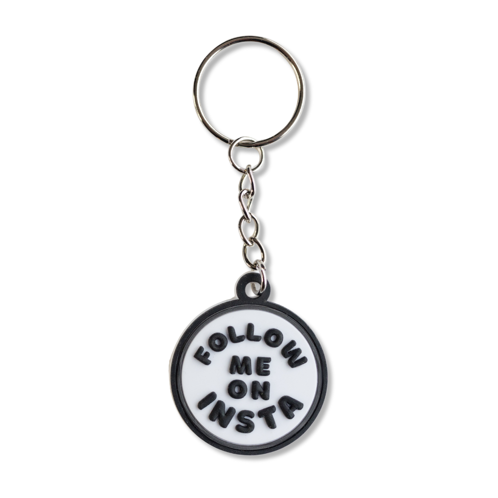 white circle keychain for influencer:  black border and black words: follow me on insta. All black parts are raised 3-D