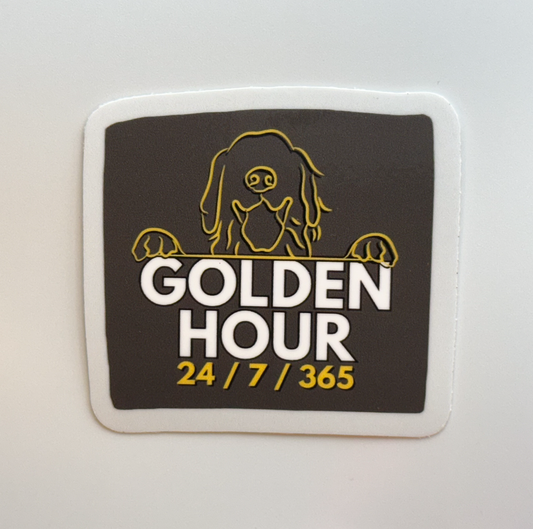 dark gray, yellow, and white golden hour golden retriever sticker with cartoon line art of golden