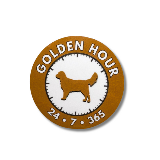 circle sticker of golden retriever with text "golden hour 27/7/365"