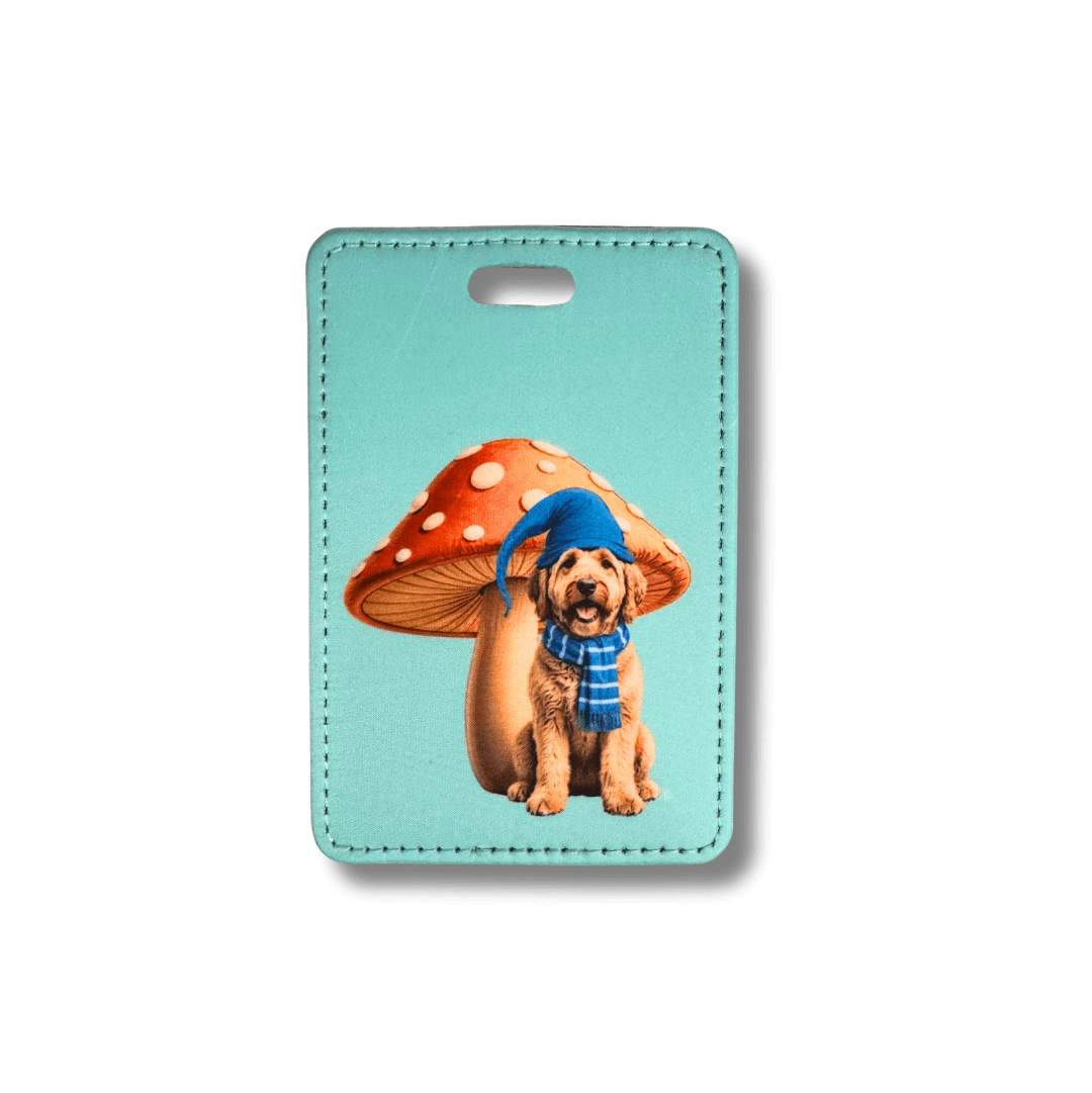 Goldendoodle uggage tag with a dog and mushroom design on a light blue background