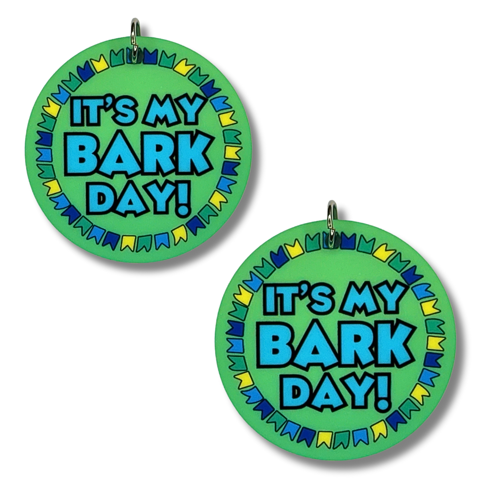 blue and green dog birthday harness or collar charms. Tiny green, blue and yellow flag border with light blue IT'S MY BARK DAY! in the center.