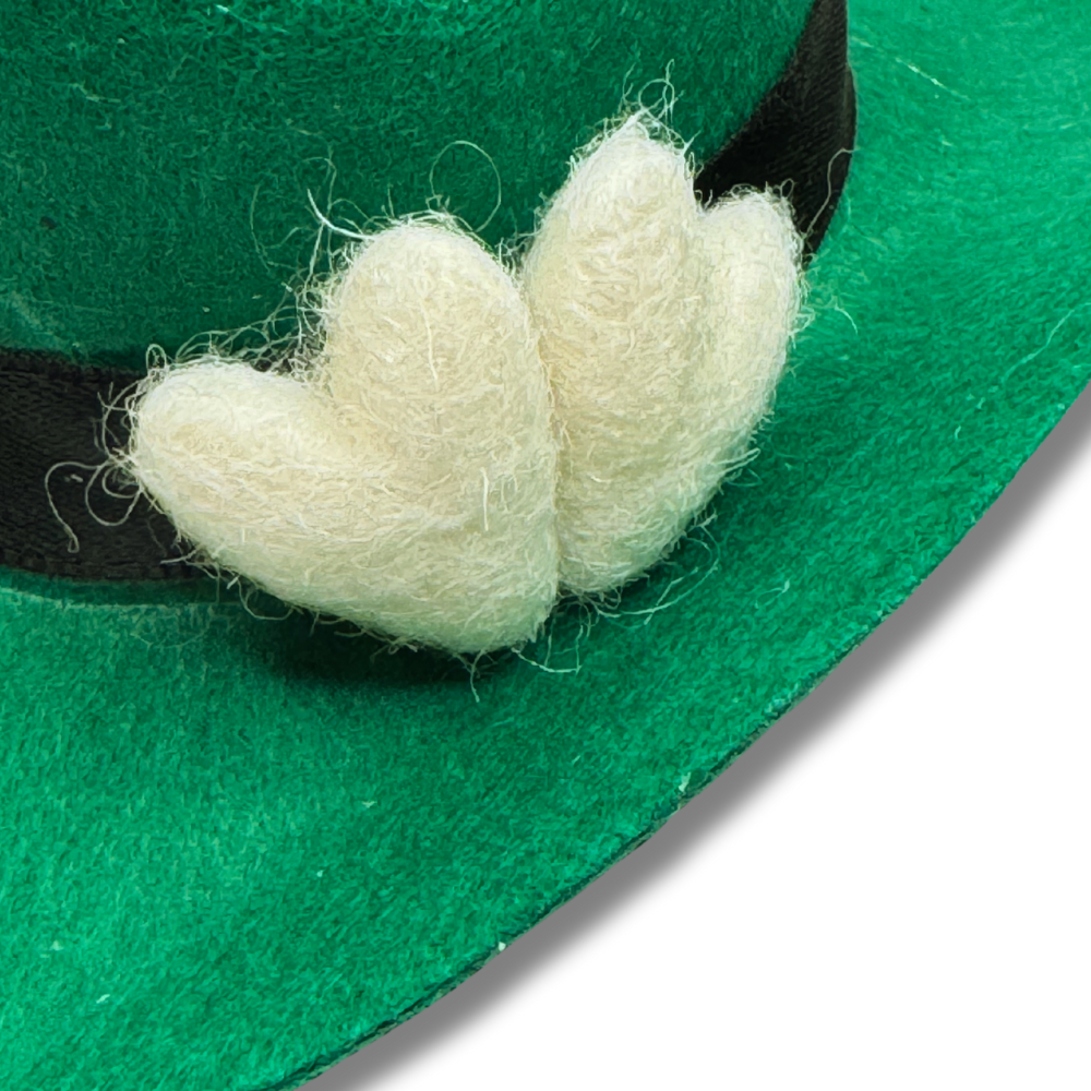 close up of white wool felt hearts that accent our green mini dog cowboy hat for St. Patrick's Day