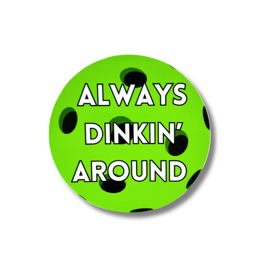 green sticker of a Pickleball ball with white and black text: Always dinkin' around