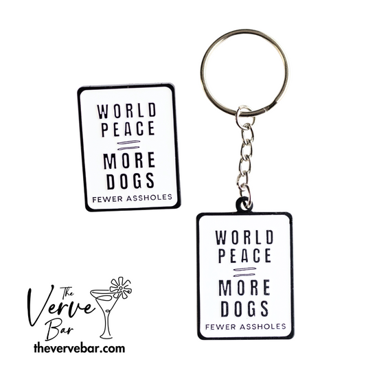 white rectangle pin and keychain with black letters: world peace = more dogs, fewer assholes