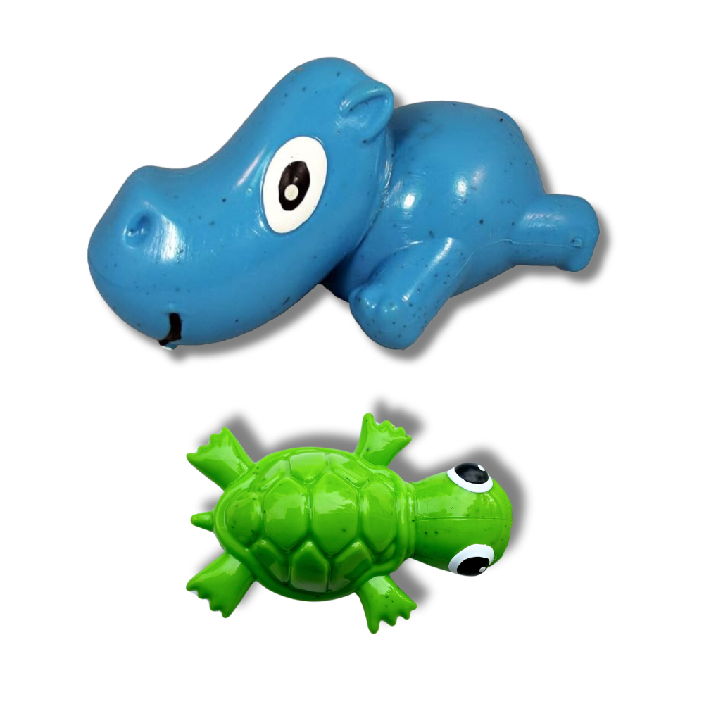 top view of blue hippo and green turtle dog toys