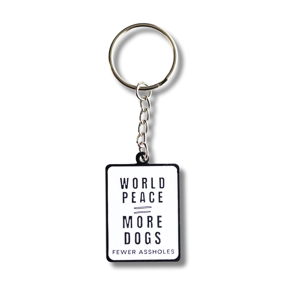 white rectangle enamel keychain: world peace = more dogs / fewer assholes