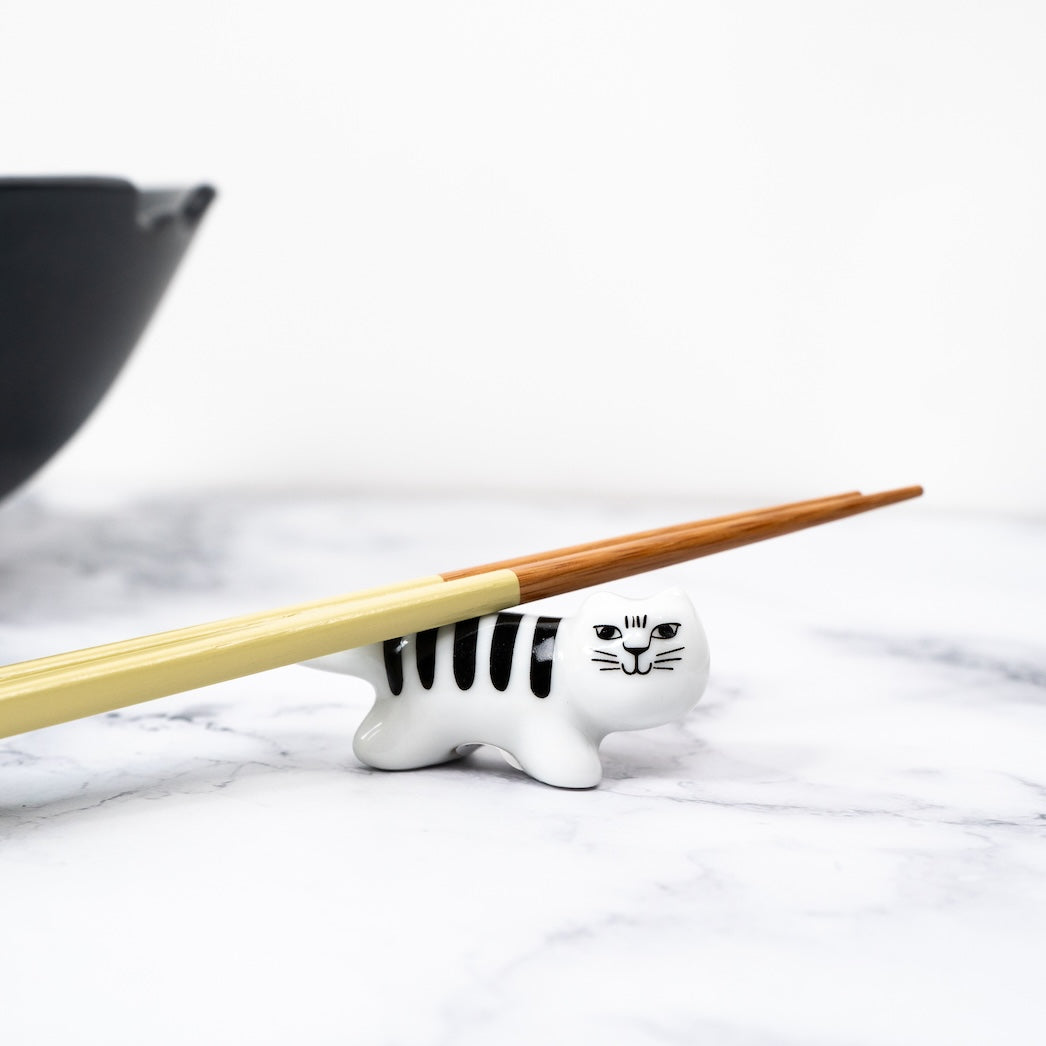 black and white striped kitten chopstick rest