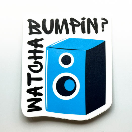 Royal blue speaker with black words "watcha bumpkin?"