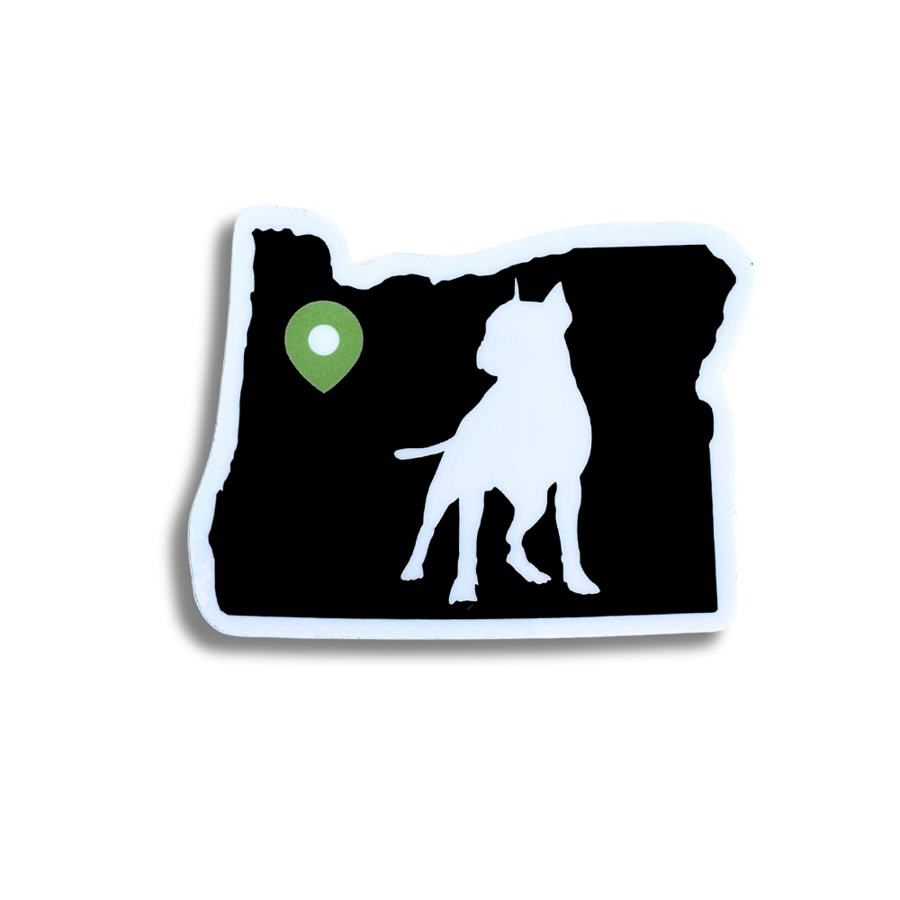 sticker: shape of oregon in black with a green location pin near Portland.  Silhouette of pit bull dog