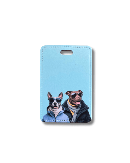 pit bull mountain dog luggage tag; two winter-clothed dogs in sunglasses printed on blue faux leather tag