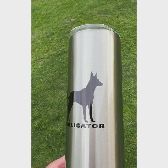 Video: Stainless steel Malinois Maligator Tumbler featuring a black silhouette of a Belgian Malinois.