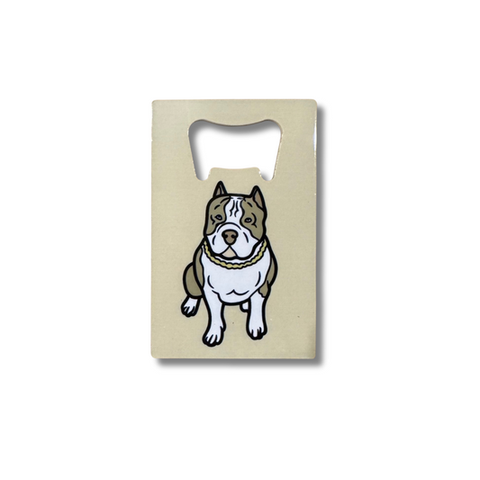 Cute pit bull or other bully breed brown and white dog on a beige flat bottle opner that is small enough to fit in wallets.