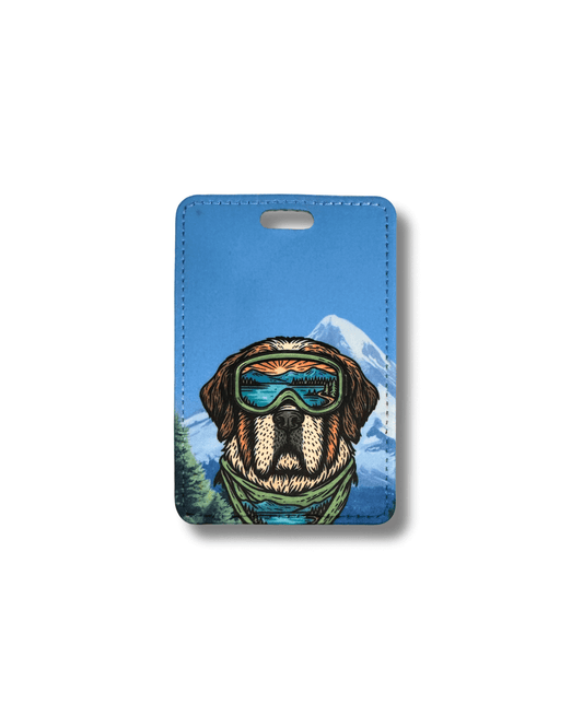 St. Bernard luggage tag with a dog wearing goggles and a mountain background