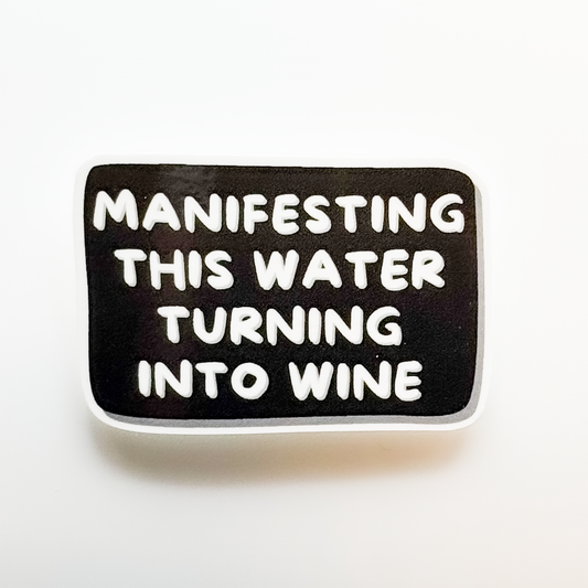 BLACK AND WHITE STICKER "Manifesting this water turning into wine."