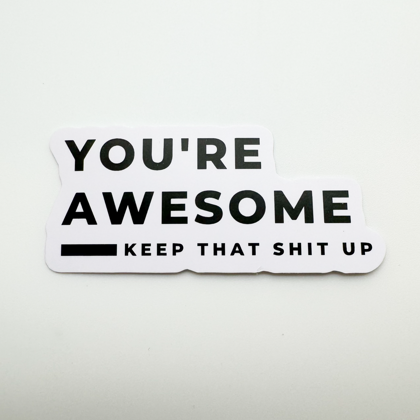 white vinyl motivational sticker "You're awesome, keep that shit up"