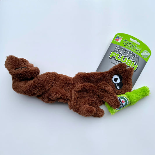 Plush unstuffed Squirrel with springy tail dog toy. Squirrel is holding a green beer bottle.
