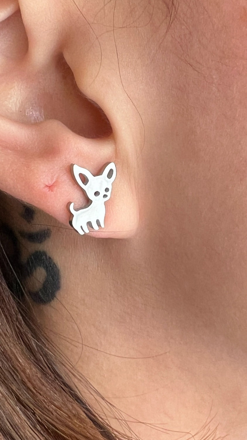 close up of silver chihuahua earring in ear to show size