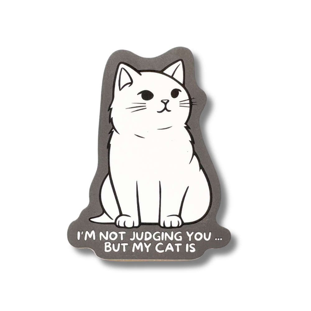 Cat sticker. White cartoon cat with gray background "I'm not judging you but my cat is." 