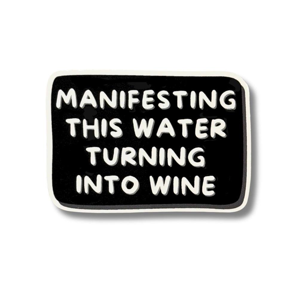 hilarious water bottle sticker, black with white text "manifesting this water turning into wine"