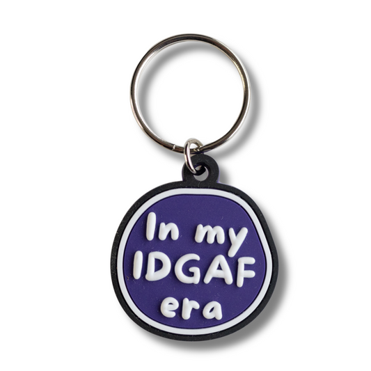 purple, black and white round dog collar charm with raised letters "in my IDGAF era"