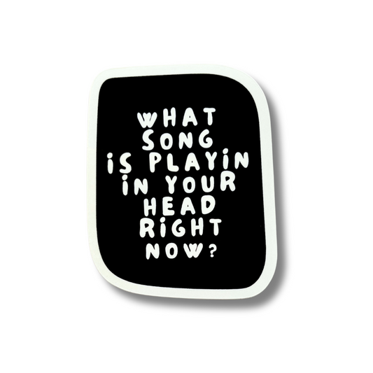 Vertical rectangle black sticker with white border and white text "what song is playin' in your head right now?"