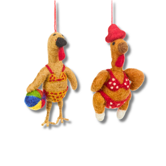 Funny Turkey ornaments for Thanksgiving. One is wearing a yellow and red bikini and holding a colorful beach ball. The other turkey is wearing a red hat and a red and white bikini.