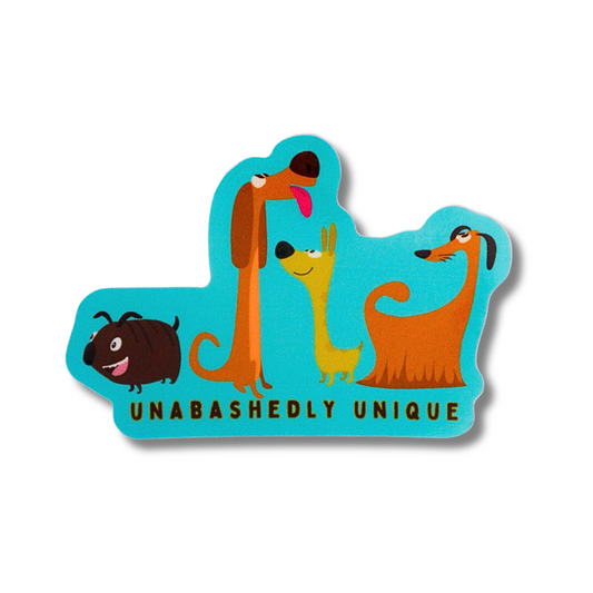 teal sticker of 3 cute, happy, cartoon dogs that are all very unique looking ... text: "unabashedly unique"