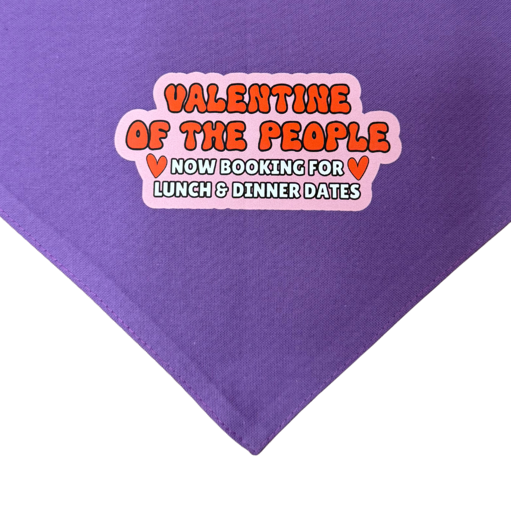 Purple dog valentine bandana that has pink, red and white font (and a couple small red hearts): Valentine of the people, now booking for lunch and dinner dates.