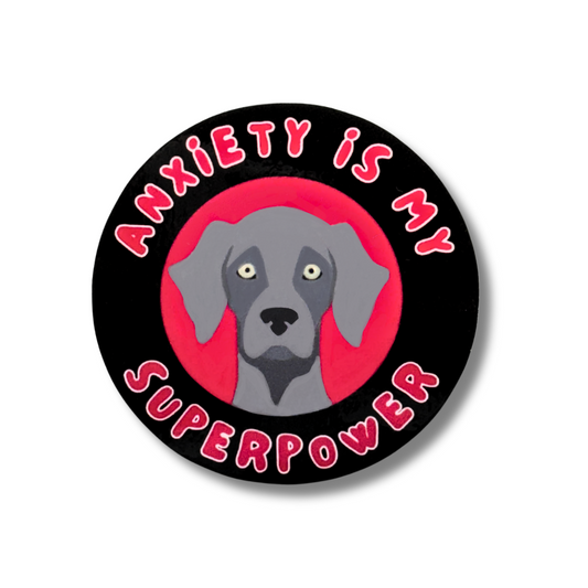 black and red circle weimaraner sticker. Cartoon weim dog in center. Text: Anxiety is my superpower