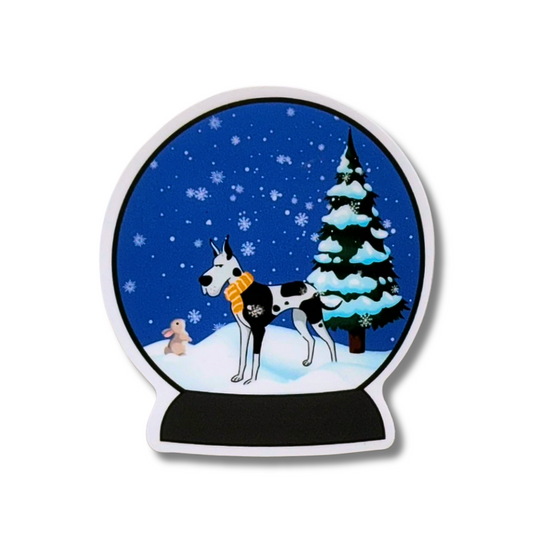 Winter snow globe waterproof sticker - black and white Great Dane dog looking at tiny bunny in the snow. Christmas tree behind them.