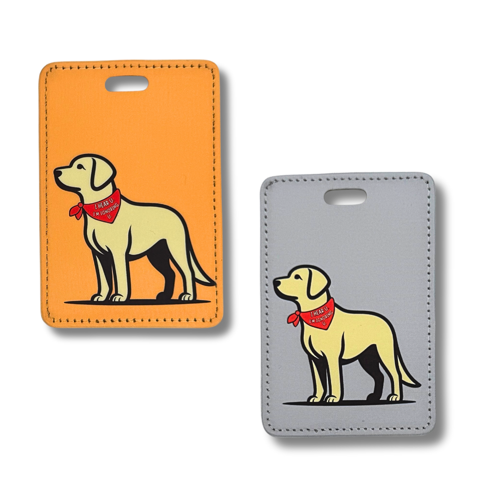 Image of both the orange and gray labrador dog luggage tags featuring a minimalist cartoon drawing of a yellow lab.